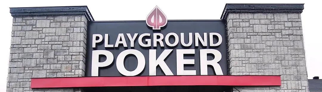 The stone-pillared entrance of Playground Poker Club in Kahnawà:ke under its PLAYGROUND POKER sign, October 2018.